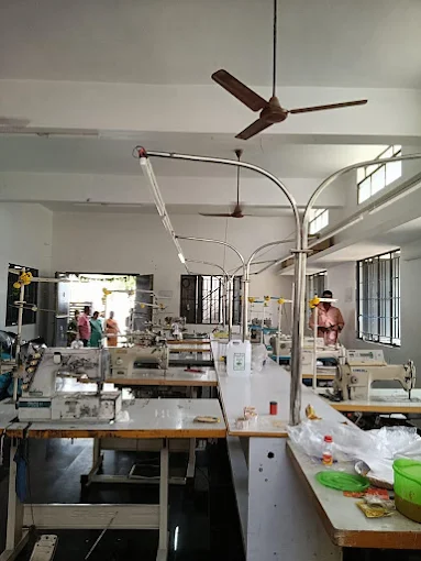 Inside the SK GARMENTS shop, with sewing machines and garment workstations